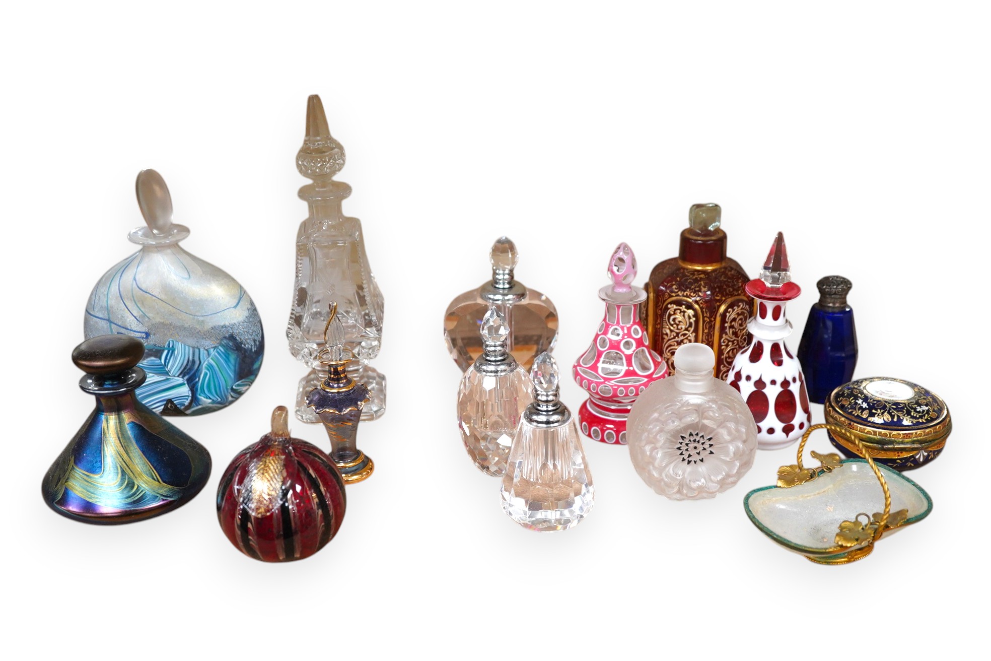 A collection of various glass scent bottles including a Lalique flower scent bottle and Bohemian examples, tallest 20.5cm. Condition - fair, some stoppers stuck